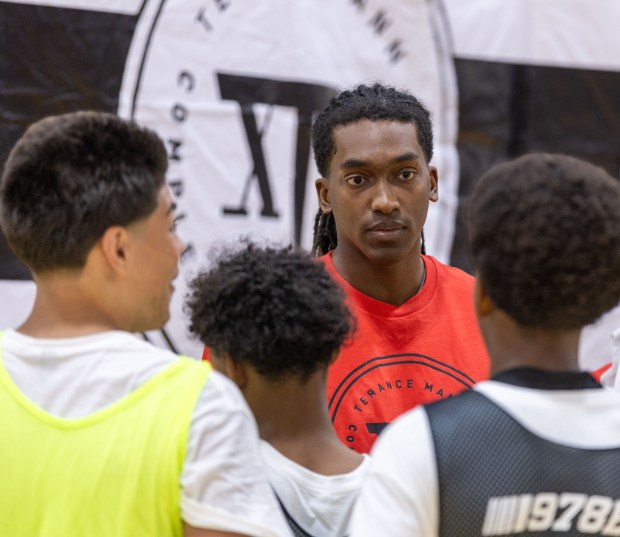 Brooklyn Nets guard and Lowell native Terance Mann addresses a group of participants before a showcase game during his basketball camp in Westford. James Thomas for the Lowell Sun