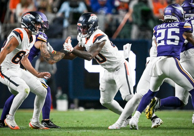 Justin Joly (80) of the Denver Broncos blocks Chaz Chambliss (40) of the Minnesota Vikings during the third quarter at Empower Field at Mile High in Denver, Colorado on Friday, August 28, 2026. (Photo by AAron Ontiveroz/The Denver Post)