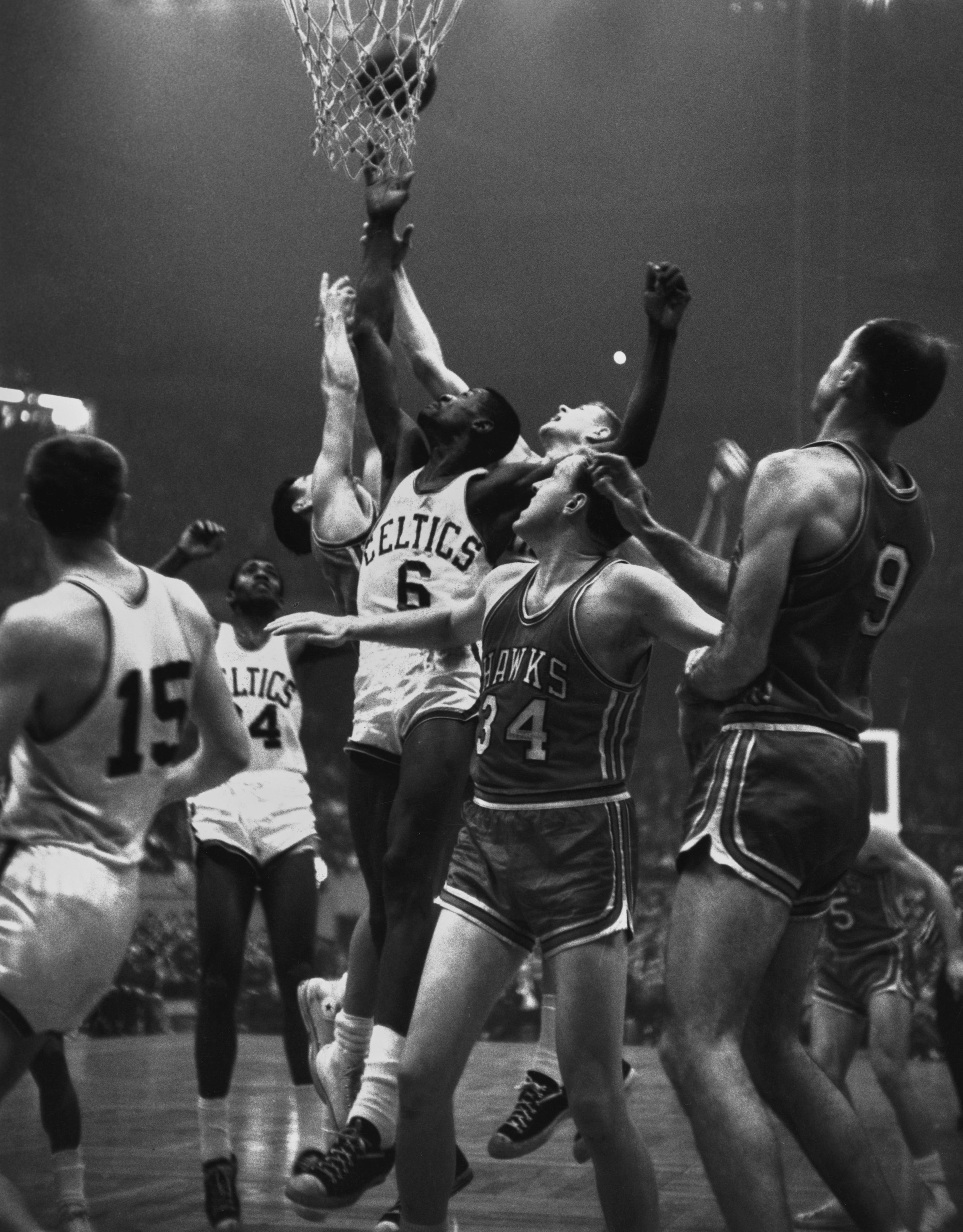 Bill Russell (#6) in the middle of Game 7 action vs. the St. Louis Hawks. (Photo by UPI/Bettmann Archive/Getty Images)