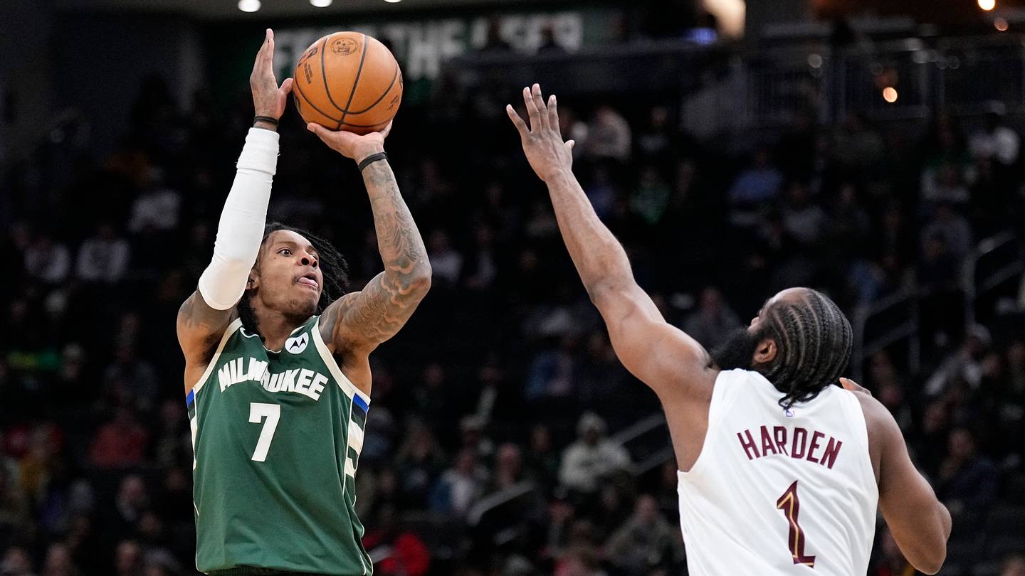 Mar 17, 2026; Milwaukee, Wisconsin, USA; Milwaukee Bucks guard/forward Kevin Porter Jr. (7) shoots against Cleveland Cavaliers guard James Harden (1) in the second half at Fiserv Forum. Mandatory Credit: Michael McLoone-Imagn Images