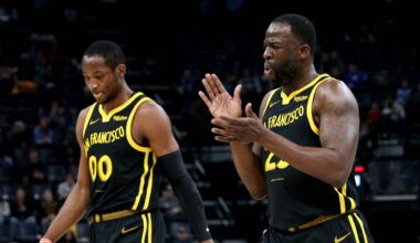 Memphis, Tennessee, USA; Golden State Warriors forward Jonathan Kuminga (00) and Golden State Warriors forward Draymond Green (23) walk to the bench at the end of the first quarter against the Memphis Grizzlies  at FedExForum. Mandatory Credit: Petre Thomas-USA TODAY Sports