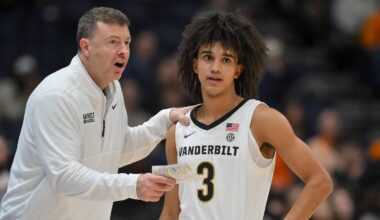 Mar 13, 2026; Nashville, TN, USA; Vanderbilt Commodores head coach Mark Byington talks with guard Tyler Tanner (3) during a break in action against the Tennessee Volunteers  during the second half at Bridgestone Arena. Mandatory Credit: Steve Roberts-Imagn Images