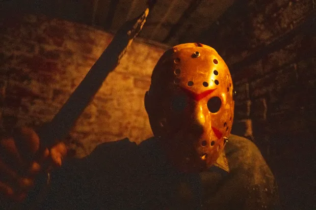 Scare actors dressed as Jason from the Friday the 13th franchise scare people as they go through a haunted house during media night at The 13th Floor in Denver on Saturday, Sept. 19, 2026