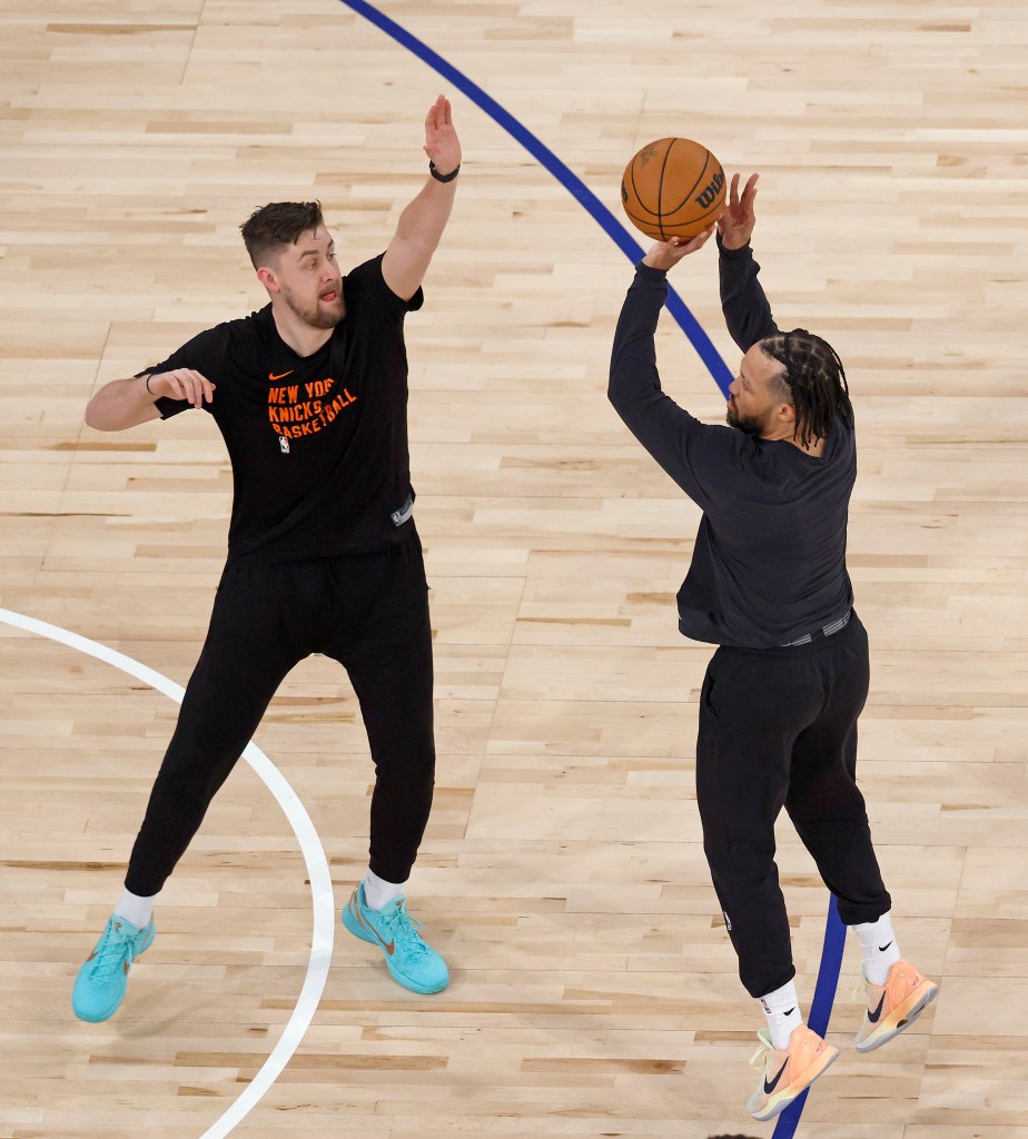 New York Knicks guard Jalen Brunson warms up with assistant coach Jordan Brink.