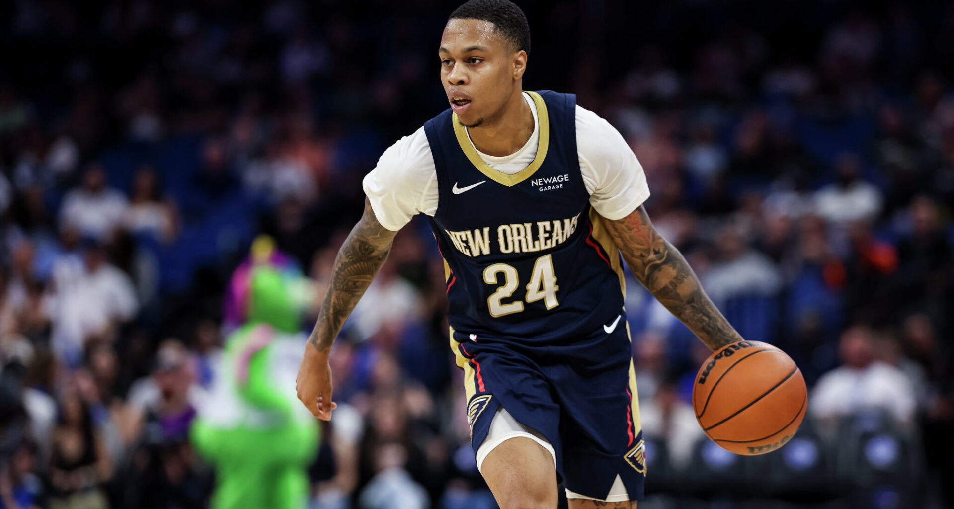 ORLANDO, FLORIDA - OCTOBER 16, 2025: Jordan Hawkins #24 of the New Orleans Pelicans brings the ball up court during the second half of a preseason game against the Orlando Magic