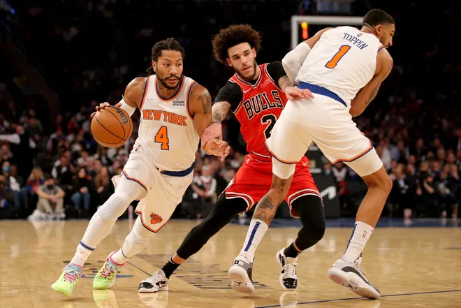 Dec 2, 2021; New York, New York, USA; New York Knicks forward Obi Toppin (1) sets a pick as guard Derrick Rose (4) drives around Chicago Bulls guard Lonzo Ball (2) during the first quarter at Madison Square Garden. Mandatory Credit: Brad Penner-USA TODAY Sports