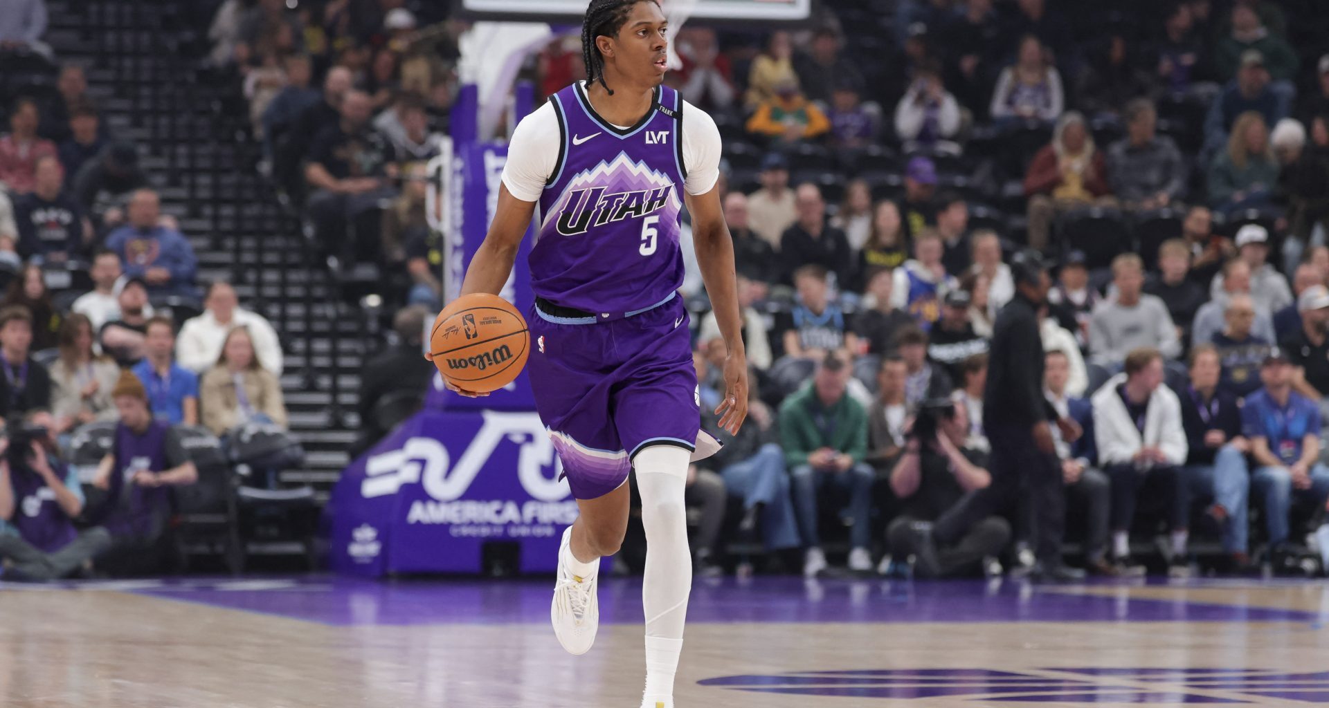 Apr 1, 2026; Salt Lake City, Utah, USA; Utah Jazz forward Cody Williams (5) brings the ball up the court against the Denver Nuggets during the first quarter at Delta Center.