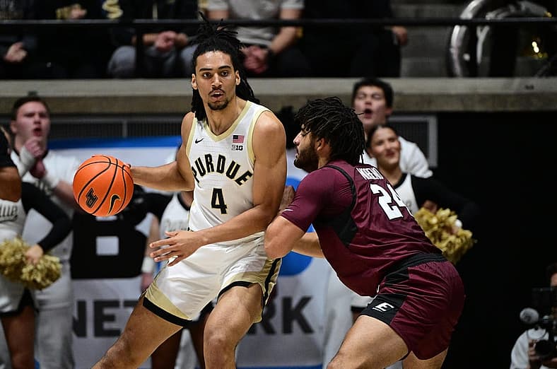 Dec 29, 2023; West Lafayette, Indiana, USA; Purdue Boilermakers forward Trey Kaufman-Renn (4) leans into Eastern Kentucky Colonels forward Michael Moreno (24) during the first half at Mackey Arena. Mandatory Credit: Marc Lebryk-USA TODAY Sports