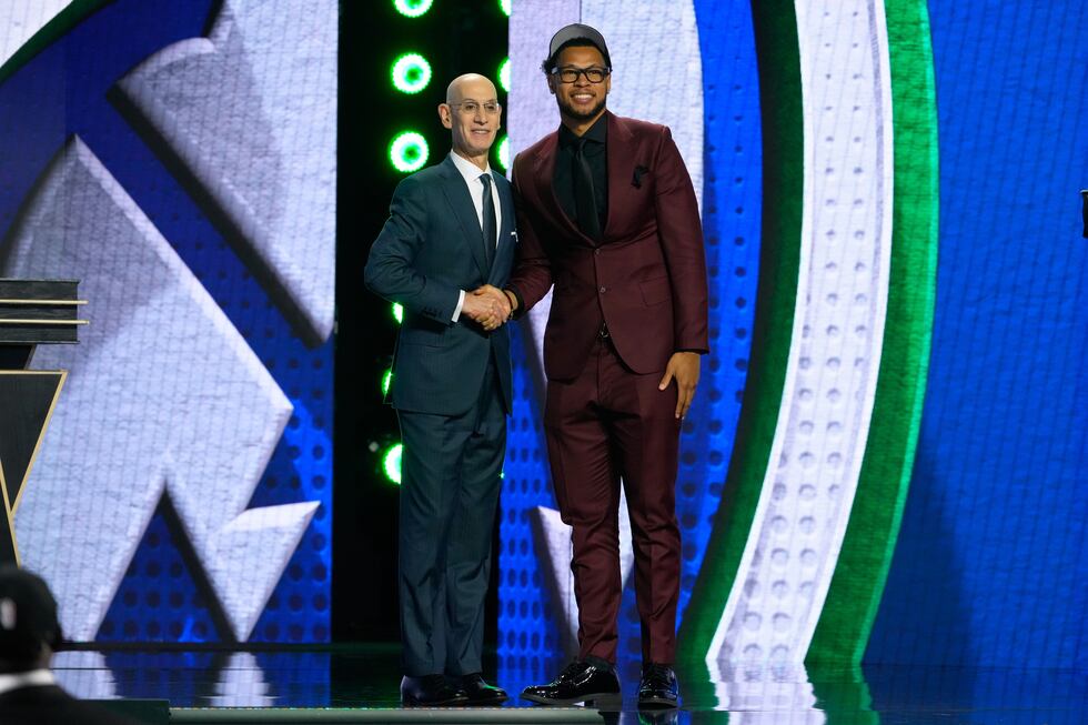 Joshua Jefferson, right, poses for a photo with NBA Commissioner Adam Silver, left, after...