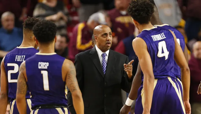 Washington head coach Lorenzo Romar talks to his team during a timeout against Arizona State during the second half at Wells Fargo Arena in Tempe, Ariz. January 25, 2017.
