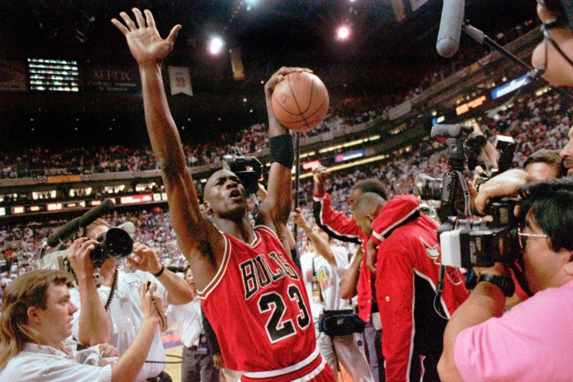 The Chicago Bulls Michael Jordan celebrates after the Bulls beat the Phoenix Suns 99-98 to win their third consecutive NBA title in Phoenix