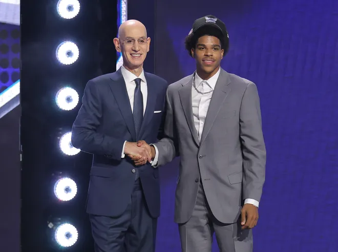 Jun 23, 2026; New York, NY, USA; NBA commissioner Adam Silver greets the eighteenth pick in the 2026 NBA draft, Texas Tech guard Christian Anderson Jr. after he was selected by the Charlotte Hornets at Barclays Center. Mandatory Credit: Brad Penner-Imagn Images