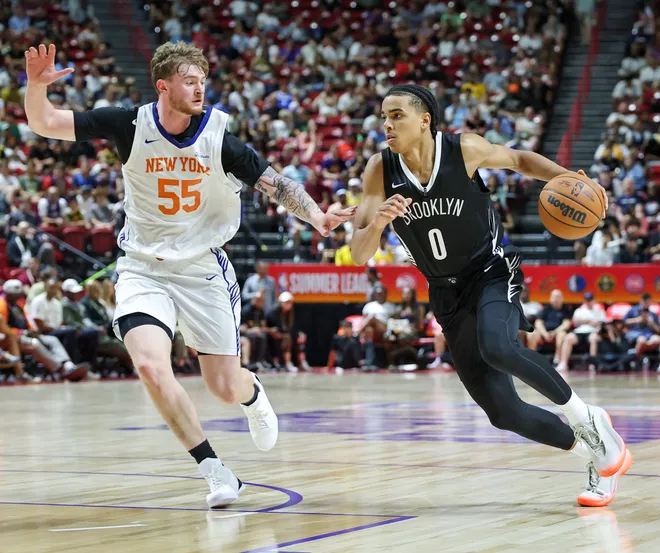 Mikel Brown Jr. #0 of the Brooklyn Nets drives against Tyler Nickel #55 of the New York Knicks in the first half of a 2026 NBA Summer League game at the Thomas & Mack Center on July 10, 2026 in Las Vegas, Nevada. (Photo by Ethan Miller/Getty Images)