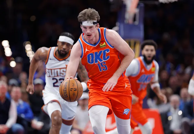 Dec 10, 2025; Oklahoma City, Oklahoma, USA; Oklahoma City Thunder center Branden Carlson (15) recovers a loose ball during a play against the Phoenix Suns during the second half at Paycom Center. Mandatory Credit: Alonzo Adams-Imagn Images