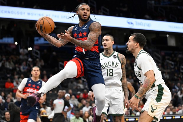 Washington Wizards forward Cam Whitmore (1) playing against the Milwaukee Bucks during the second half of an NBA basketball game, Monday, Dec. 1, 2025, in Washington. (AP Photo/John McDonnell)