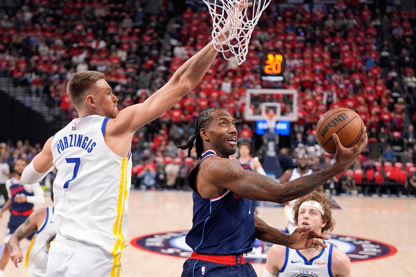 Kawhi Leonard (center) is returning to a Raptors team that he won an NBA championship with in 2018-19.