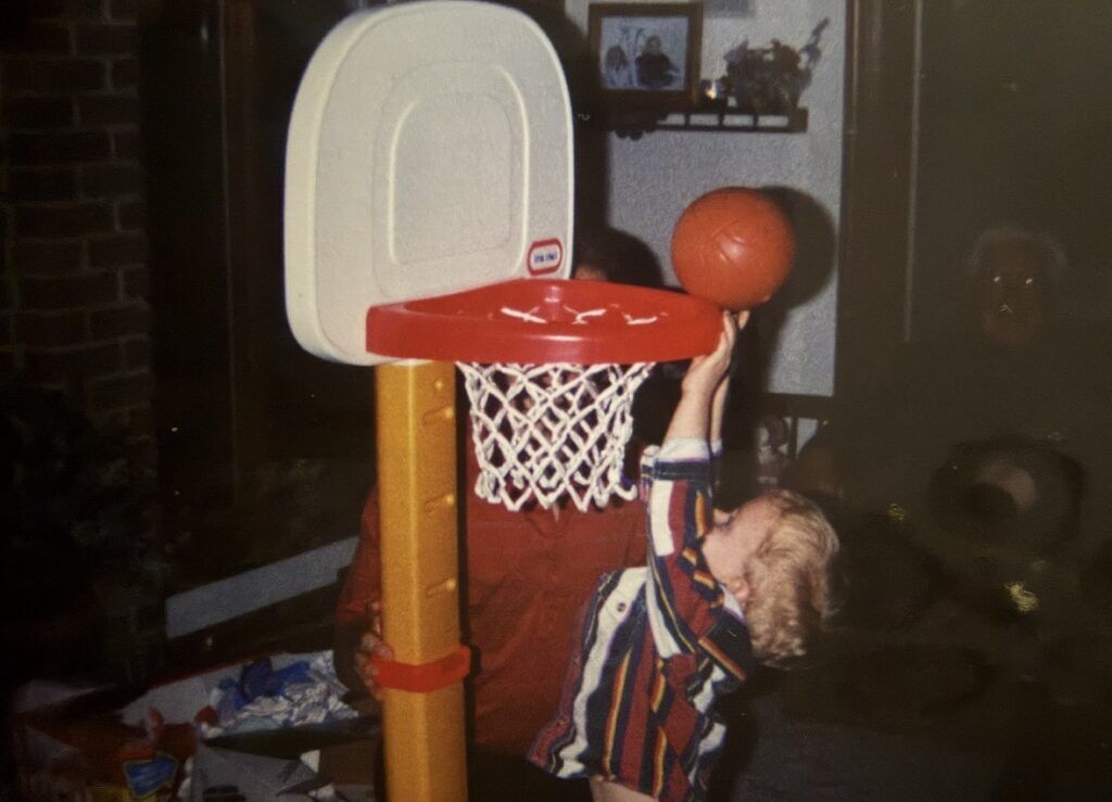 Noah Reed plays on the Little Tikes hoop in his family's living room. Photo courtesy of Noah Reed