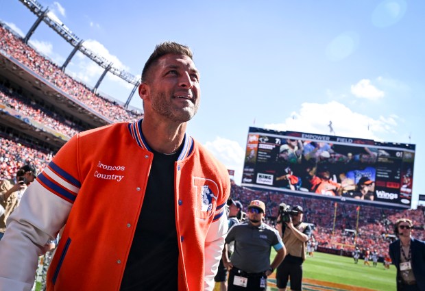 DENVER , CO - SEPTEMBER 20: Denver Broncos legend Tim Tebow is honored during the second quarter against the Jacksonville Jaguars at Empower Field at Mile High in Denver, Colorado on Sunday, September 20, 2026. (Photo by AAron Ontiveroz/The Denver Post)