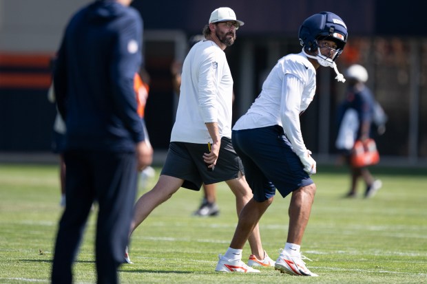 Offensive coordinator Davis Webb for the Denver Broncos looks on as tight end Evan Engram (1) prepares for a play during practice on Thursday, August. 6, 2026, at Broncos Park in Centennial, Colo.(Photo by Timothy Hurst/The Denver Post)