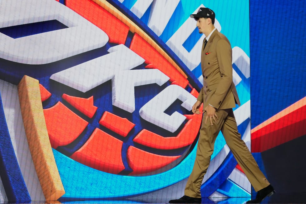 Aday Mara walks off the stage after being selected by the Oklahoma City Thunder as the 12th...