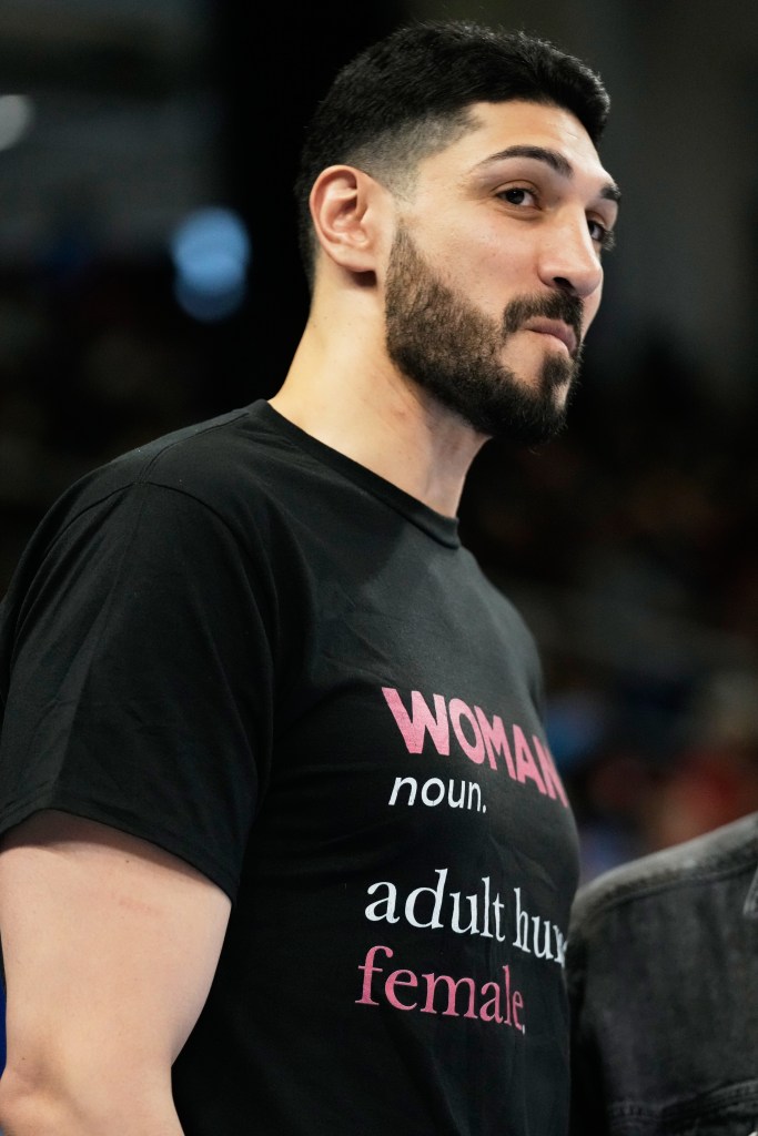 Former NBA center Enes Kanter Freedom watches Indiana Fever players warm up before a WNBA basketball game against the Chicago Sky