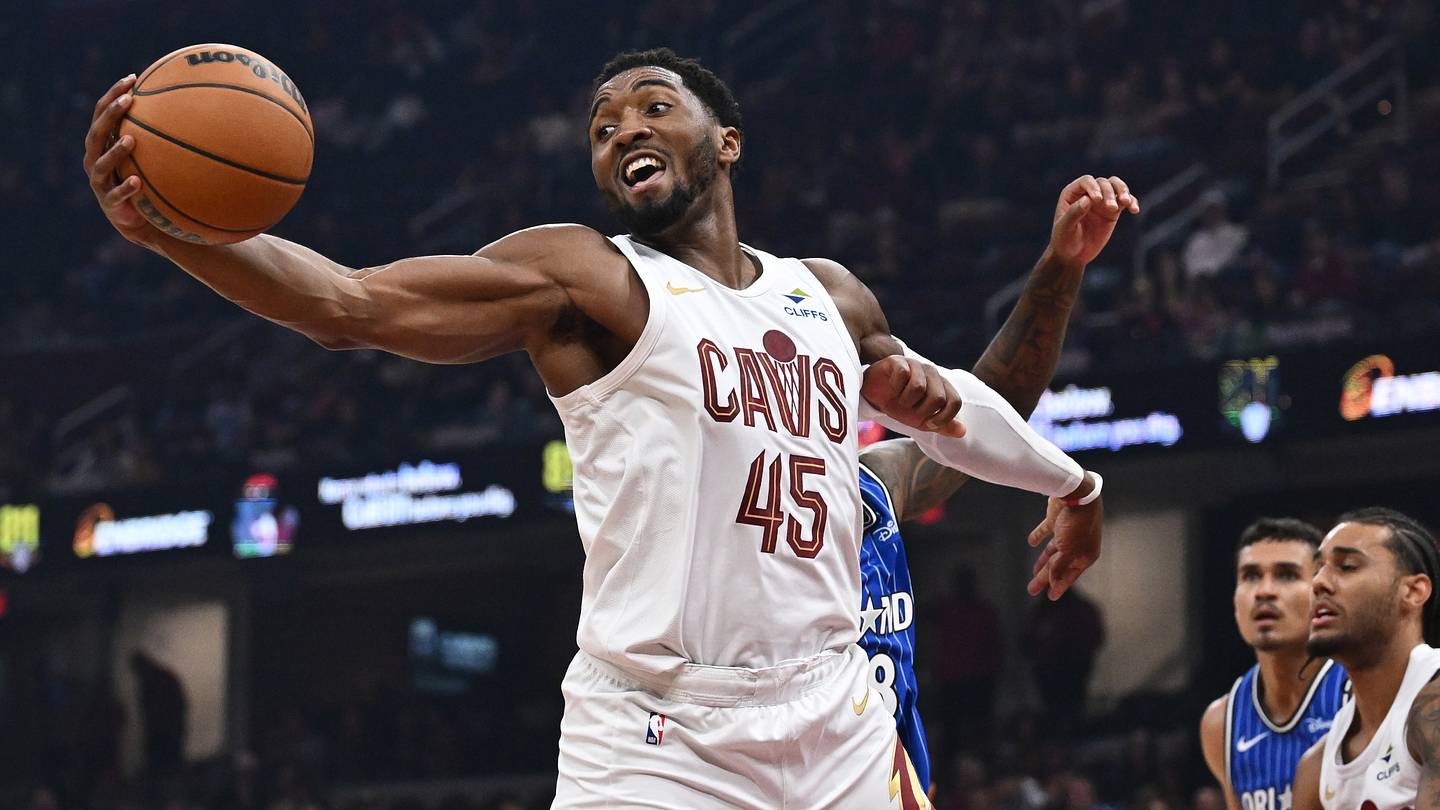 Oct 11, 2026; Cleveland, Ohio, USA; Cleveland Cavaliers guard Donovan Mitchell (45) grabs a rebound during the first half against the Orlando Magic at Rocket Arena. Mandatory Credit: Ken Blaze-Imagn Images