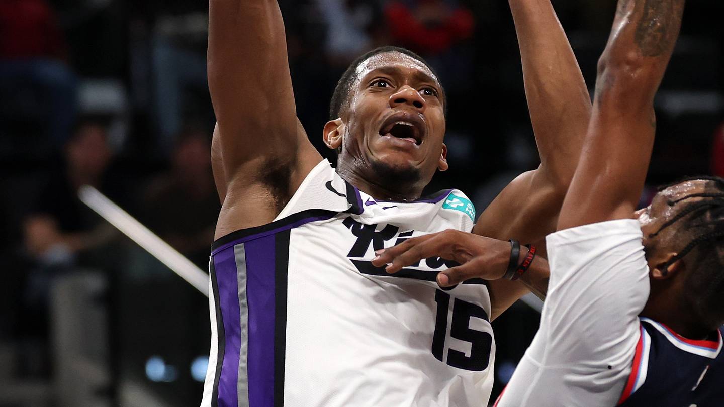Oct 21, 2026; Inglewood, California, USA;  Sacramento Kings forward/guard De'andre Hunter (15) shoots the ball against Los Angeles Clippers forward Derrick Jones Jr. (5) during the third quarter at Intuit Dome. Mandatory Credit: Kiyoshi Mio-Imagn Images