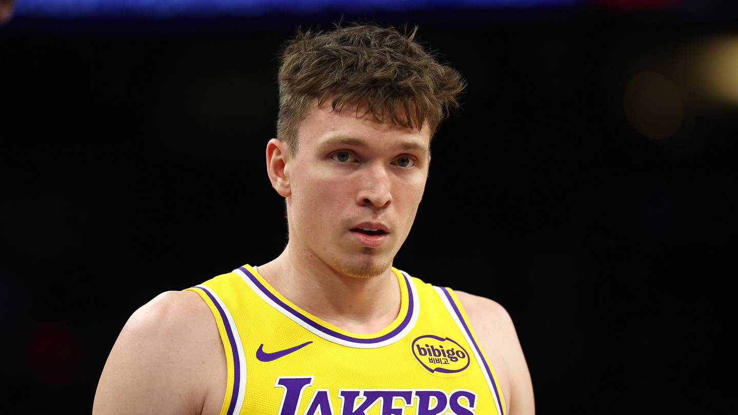 Dec 23, 2025; Phoenix, Arizona, USA; Los Angeles Lakers forward Dalton Knecht (4) against the Phoenix Suns at Mortgage Matchup Center. Mandatory Credit: Mark J. Rebilas-Imagn Images