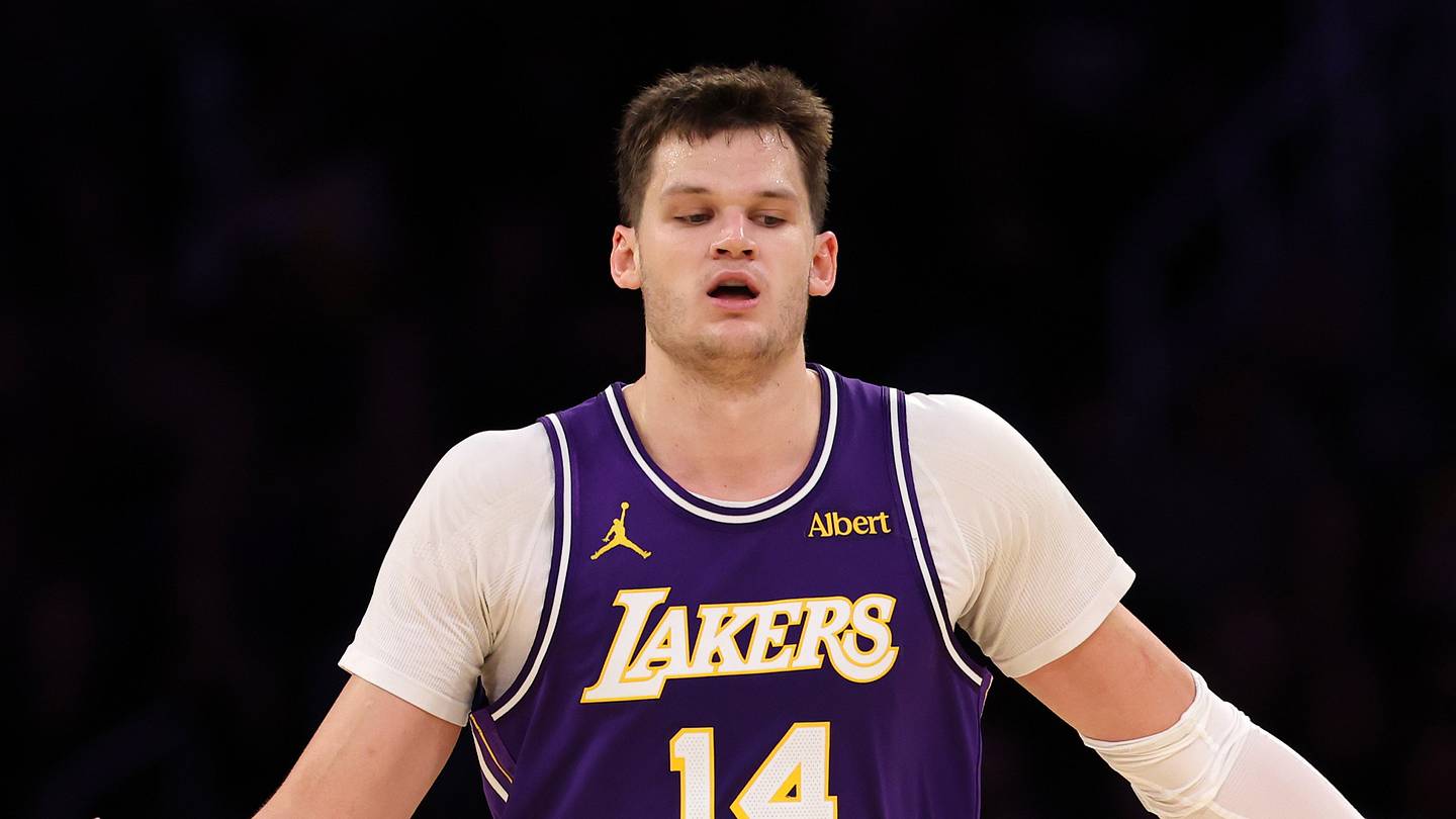 Oct 23, 2026; Los Angeles, California, USA;  Los Angeles Lakers center Walker Kessler (14) is greeted by guard Austin Reaves (15) during the fourth quarter against the Los Angeles Clippers at Crypto.com Arena. Mandatory Credit: Kiyoshi Mio-Imagn Images