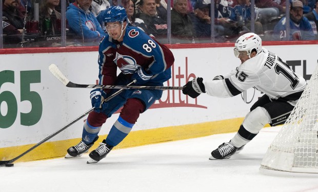 Colorado Avalanche center Martin Necas (88) moves the puck behind the Kings goal as Los Angeles Kings center Alex Turcotte (15) defends during the first period Wednesday, Sept. 30, 2026, at Ball Arena in Denver. (Christian Murdock, The Gazette)