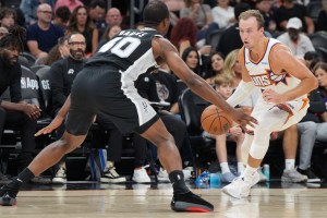 Oct 10, 2026; Phoenix, Arizona, USA; Phoenix Suns guard Luke Kennard (8) drives on San Antonio Spurs forward Harrison Barnes (40) in the first half at Mortgage Matchup Center. Mandatory Credit: Rick Scuteri-Imagn Images