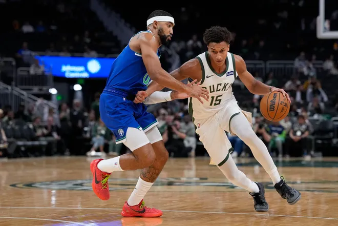 Nate Ament the Bucks drives against Minnesota's K.J. Martin during a preseason game at Fiserv Forum on Oct. 5.