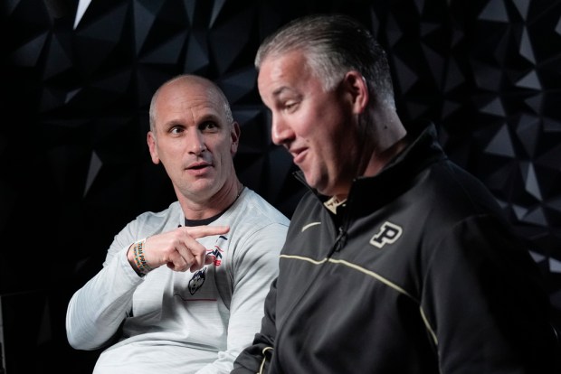 UConn head coach Dan Hurley and Purdue head coach Matt Painter talk during a CBS Sports interview ahead of a NCAA college Final Four championship basketball game, Sunday, April 7, 2024, in Glendale, Ariz. (AP Photo/David J. Phillip)