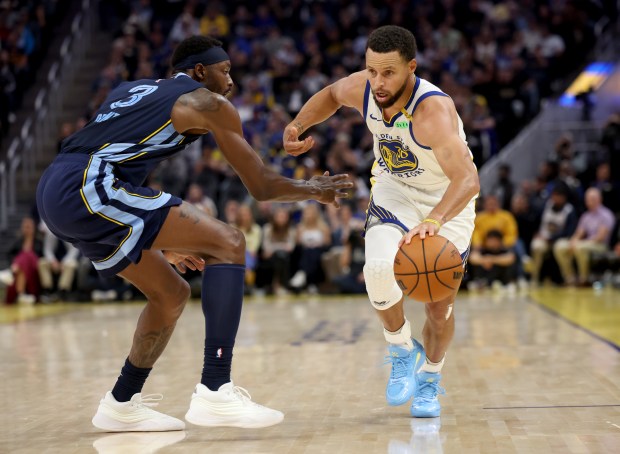 Golden State Warriors' Stephen Curry #30 brings the ball down court as he's guarded by Memphis Grizzlies' Jerami Grant #3  the second quarter of their NBA game at the Chase Center in San Francisco, Calif., on Friday, October 23, 2026. (Jane Tyska/Bay Area News Group)