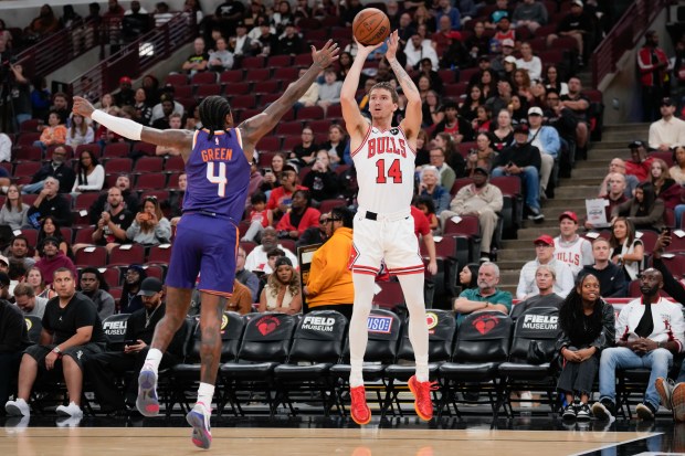 Bulls forward Matas Buzelis shoots a 3-pointer against Suns guard Jalen Green during the second half of a preseason game Wednesday, Oct. 7, 2026, at the United Center. (AP Photo/Harry Figiel)