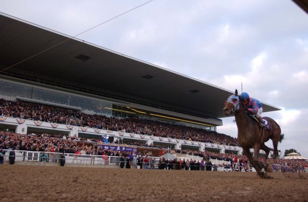 Volponi, a 43-1 longshot ridden by jockey José Santos, is all alone as he wins the Breeders' Cup Classic by 6 1/2 lengths on Oct. 26, 2002 at Arlington Park. (Jim Prisching/Chicago Tribune)