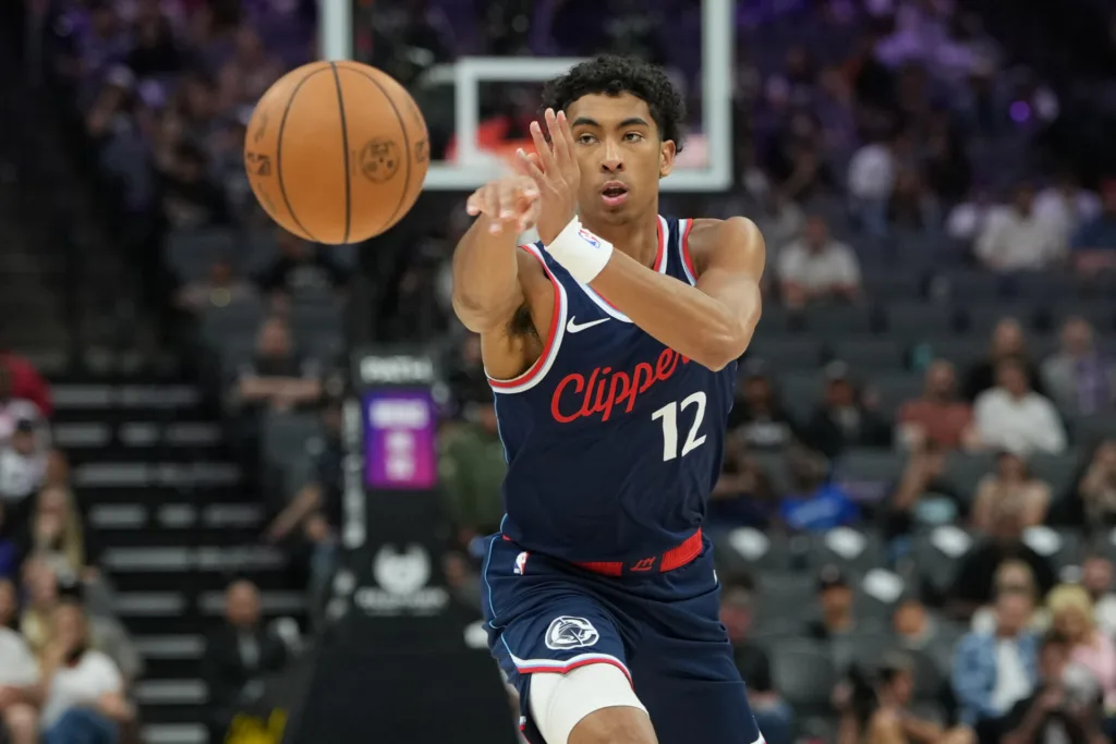Apr 5, 2026; Sacramento, California, USA; LA Clippers guard Cam Christie (12) during the fourth quarter against the Sacramento Kings at Golden 1 Center. Mandatory Credit: Darren Yamashita-Imagn Images