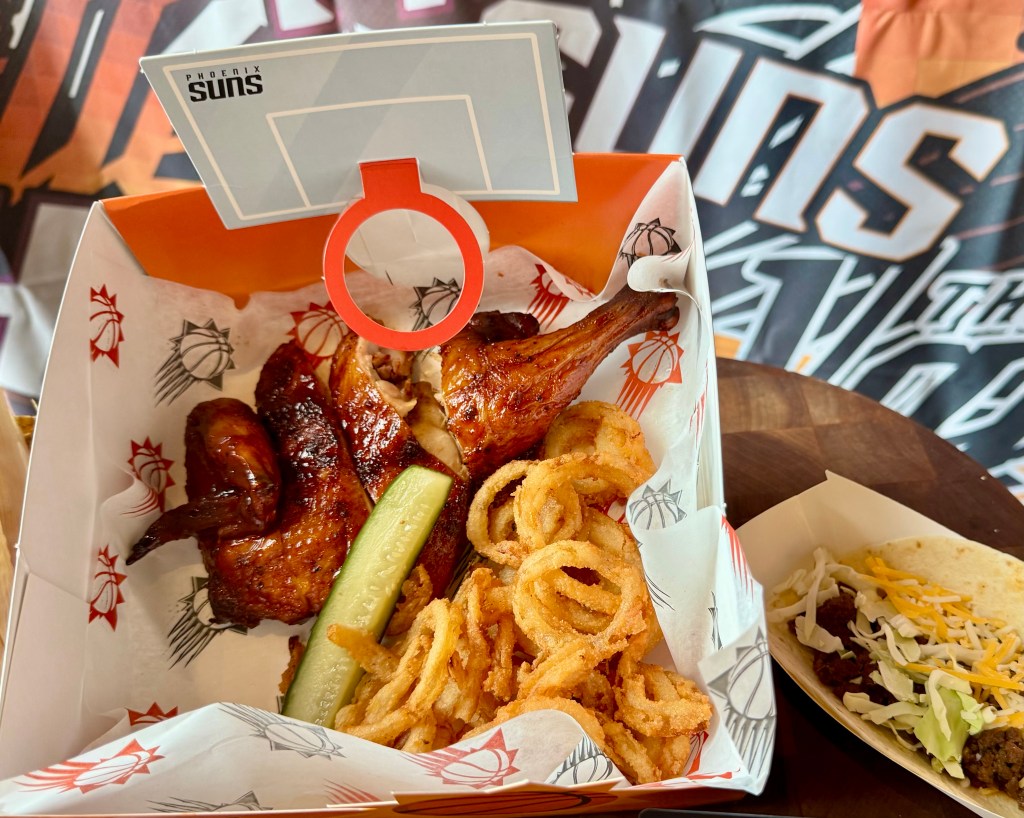 A smoked half-chicken and fried onions served at Mortgage Matchup Center.