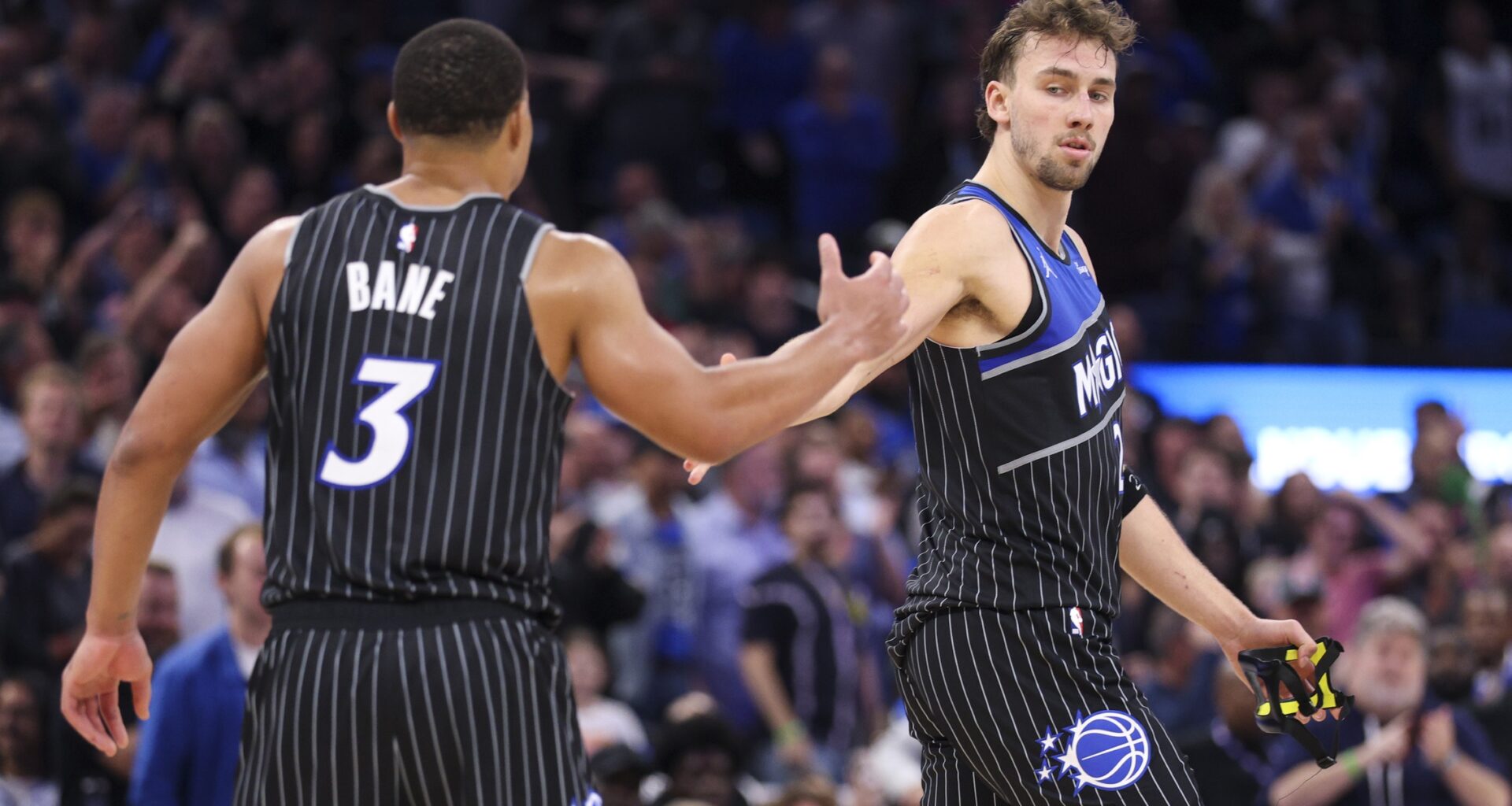 Magic stars Franz Wagner and Desmond Bane high five during a game against the Spurs in the 2025-26 NBA season.