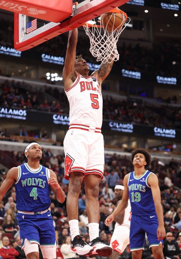 Bulls guard Dailyn Swain dunks against the Timberwolves in the first quarter of a preseason game at the United Center on Oct. 16, 2026, in Chicago. (John J. Kim/Chicago Tribune)