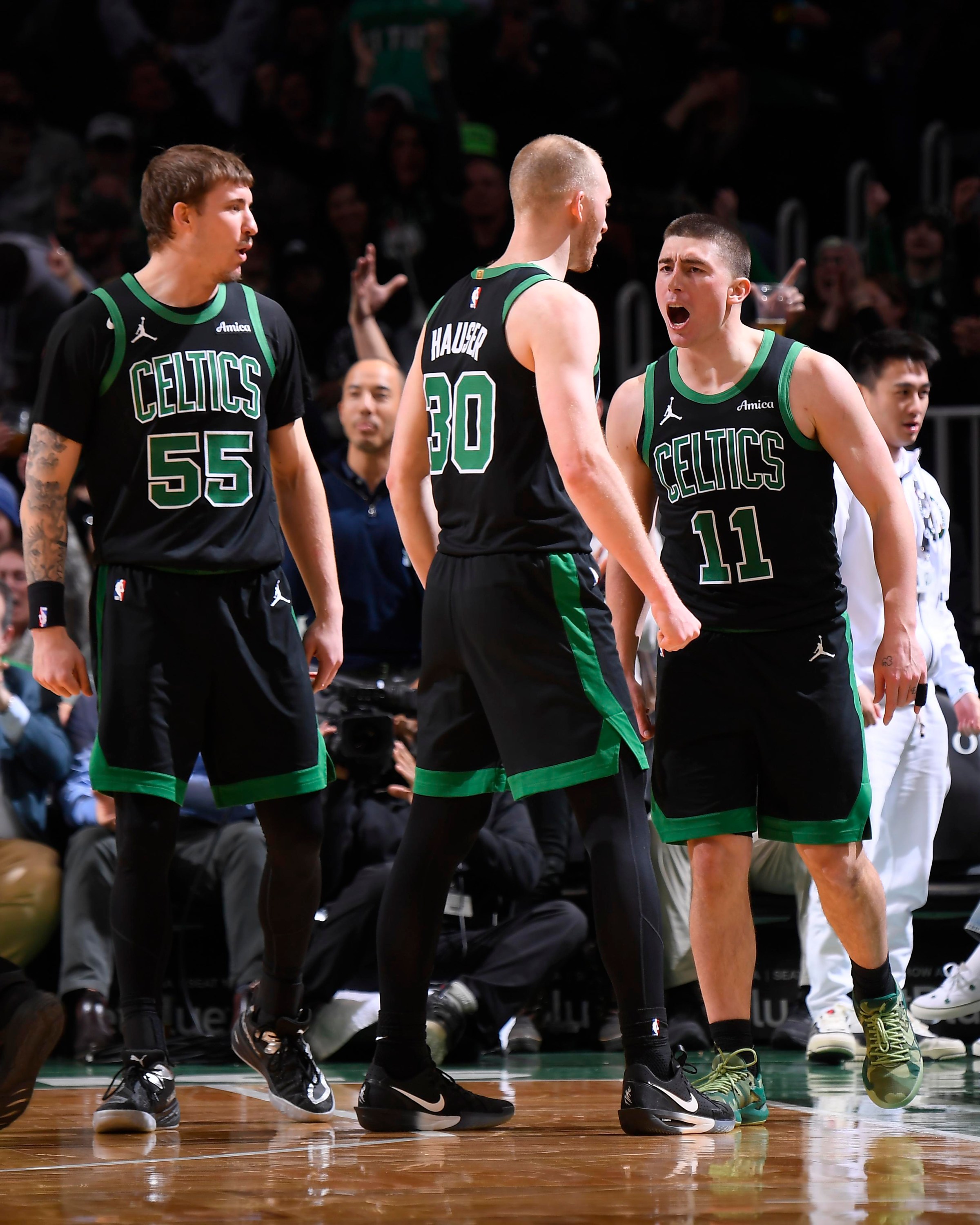 BOSTON, MA - FEBRUARY 6: Payton Pritchard #11, Sam Hauser #30 and Baylor Scheierman #55 of the Boston Celtics celebrates during the game against the Miami Heat on February 6, 2026 at TD Garden in Boston, Massachusetts. NOTE TO USER: User expressly acknowledges and agrees that, by downloading and/or using this Photograph, user is consenting to the terms and conditions of the Getty Images License Agreement. Mandatory Copyright Notice: Copyright 2026 NBAE (Photo by Brian Babineau/NBAE via Getty Images)
