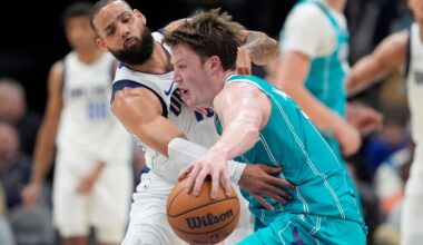 Charlotte Hornets guard Kon Knueppel drives past Dallas Mavericks forward Caleb Martin during the second half of an NBA basketball game, Tuesday, March 3, 2026, in Charlotte, N.C. (AP Photo/Chris Carlson)