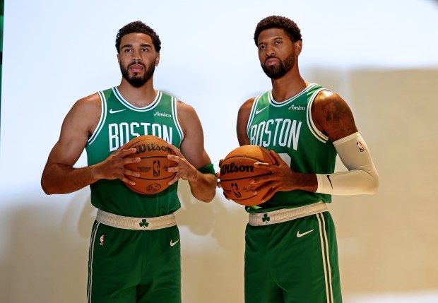 Celtics stars Jayson Tatum, left, and Paul George pose for photos during media day on Sept. 28. Nancy Lane/Boston Herald