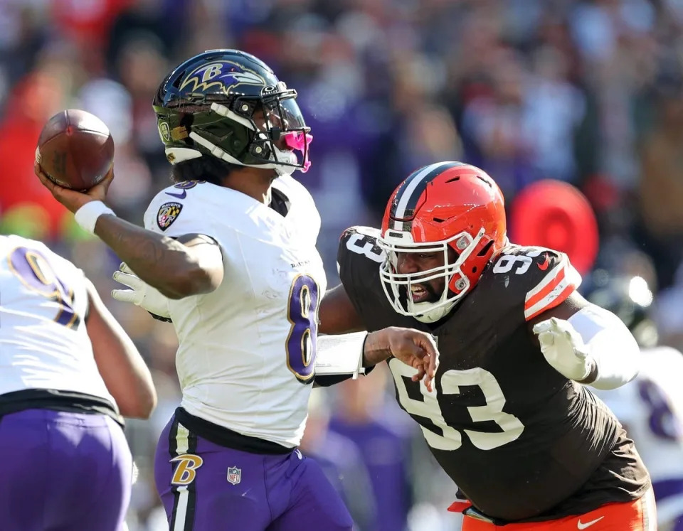 Cleveland Browns defensive tackle Shelby Harris (93) closes in on Baltimore Ravens quarterback Lamar Jackson (8) during the second half of an NFL football game at Huntington Bank Field, Sunday, Oct. 27, 2024, in Cleveland, Ohio.
