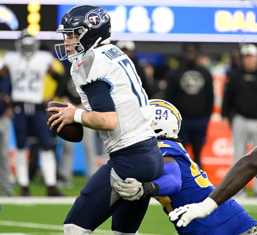 Chargers linebacker Chris Rumph II (94) sacks Tennessee Titans quarterback Ryan Tannehill (17). Mandatory Credit: Robert Hanashiro-Imagn Images