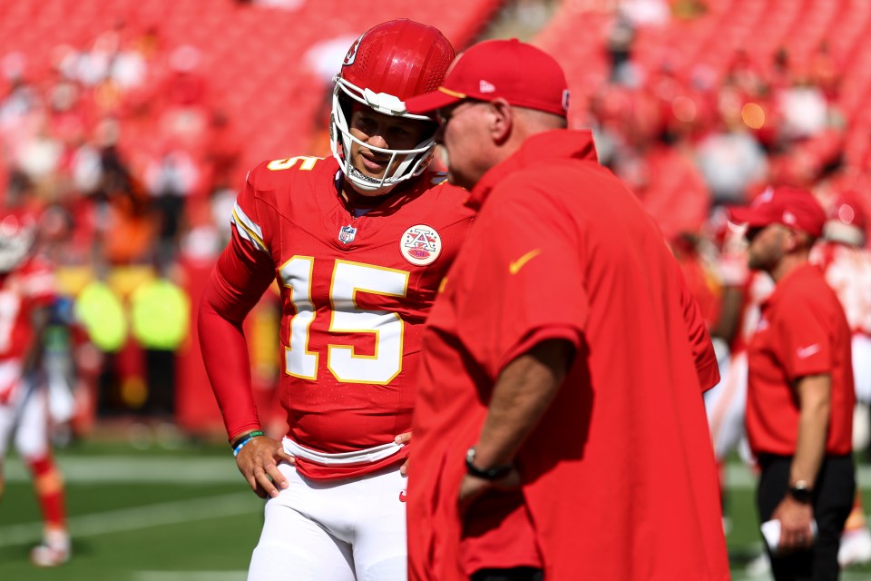Patrick Mahomes of the Kansas City Chiefs speaks with head coach Andy Reid.