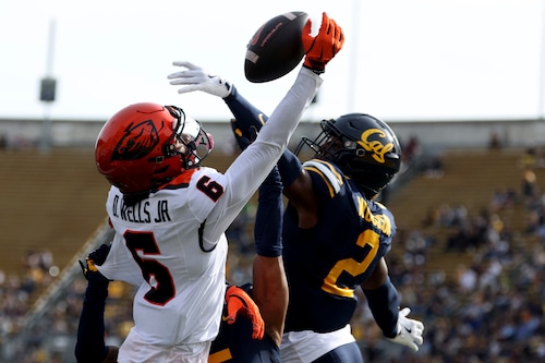 Oregon State wide receiver David Wells Jr. (6) is defended by California defensive back Craig Woodson (2) during the second half of an NCAA college football game in Berkeley, Calif., Saturday, Oct. 26, 2024. (AP Photo/Jed Jacobsohn)