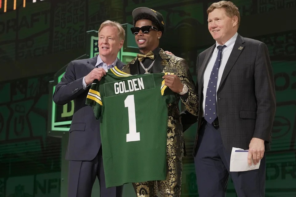 Wide receiver Matthew Golden of Texas poses with NFL Commissioner Roger Goodell and Green Bay Packers President and CEO Mark Murphy after being selected by the Green Bay Packers during the first round of the 2025 NFL Draft at Lambeau Field on April 24, 2025, in Green Bay.