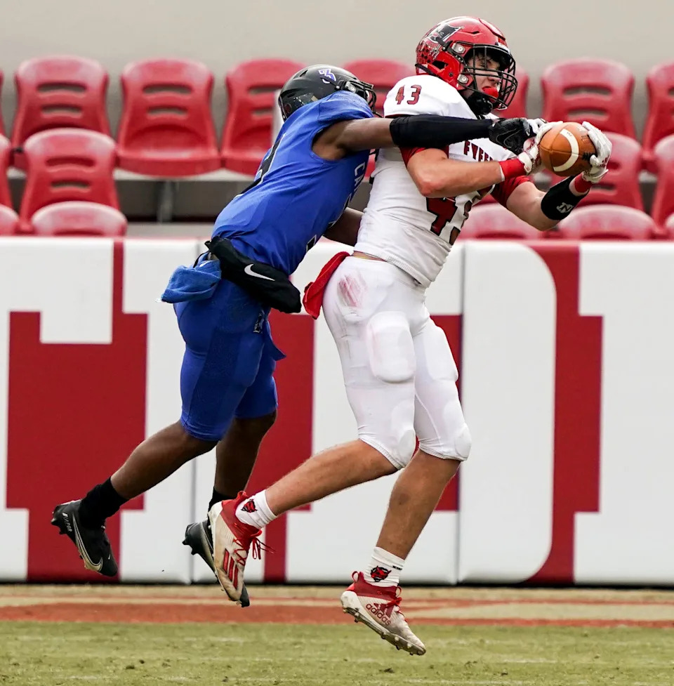 Fyffe's Brody Dalton (43) jumps to catch a pass and is defended by Montgomery Catholic's Kylon Griffin (3). Fyffe High School defeated Montgomery Catholic to win the AHSAA 3A championship on Dec. 3, 2020 at Bryant-Denny Stadium. [Photo/Hannah Saad]