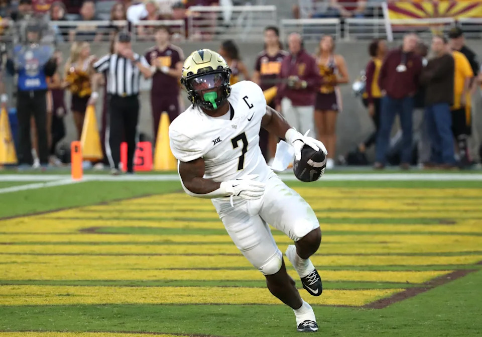 TEMPE, ARIZONA - NOVEMBER 9: Runningback RJ Harvey #7 of the UCF Knights rushes for a touchdown during the first half of a game between the University of Central Florida Knights and the Arizona State Sun Devils at Sun Devil Stadium on November 9, 2024 in Tempe, Arizona. (Photo by Bruce Yeung/Getty Images)